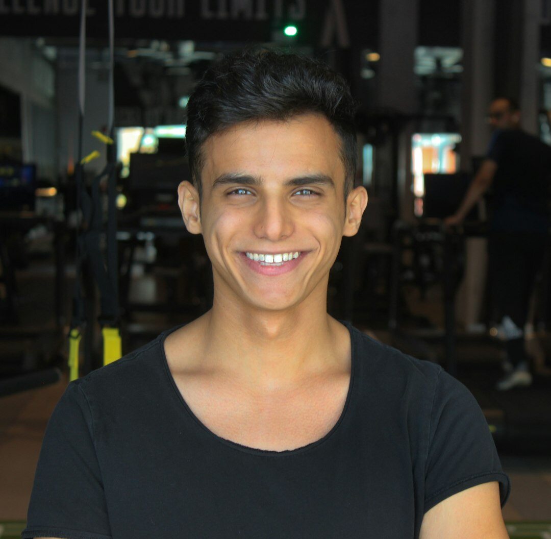Young male trainer with friendly expression